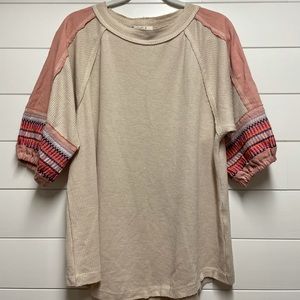 Easel top with embroidered sleeves